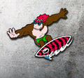 Cartoon character on a surfboard with a red and black pattern on a gray background